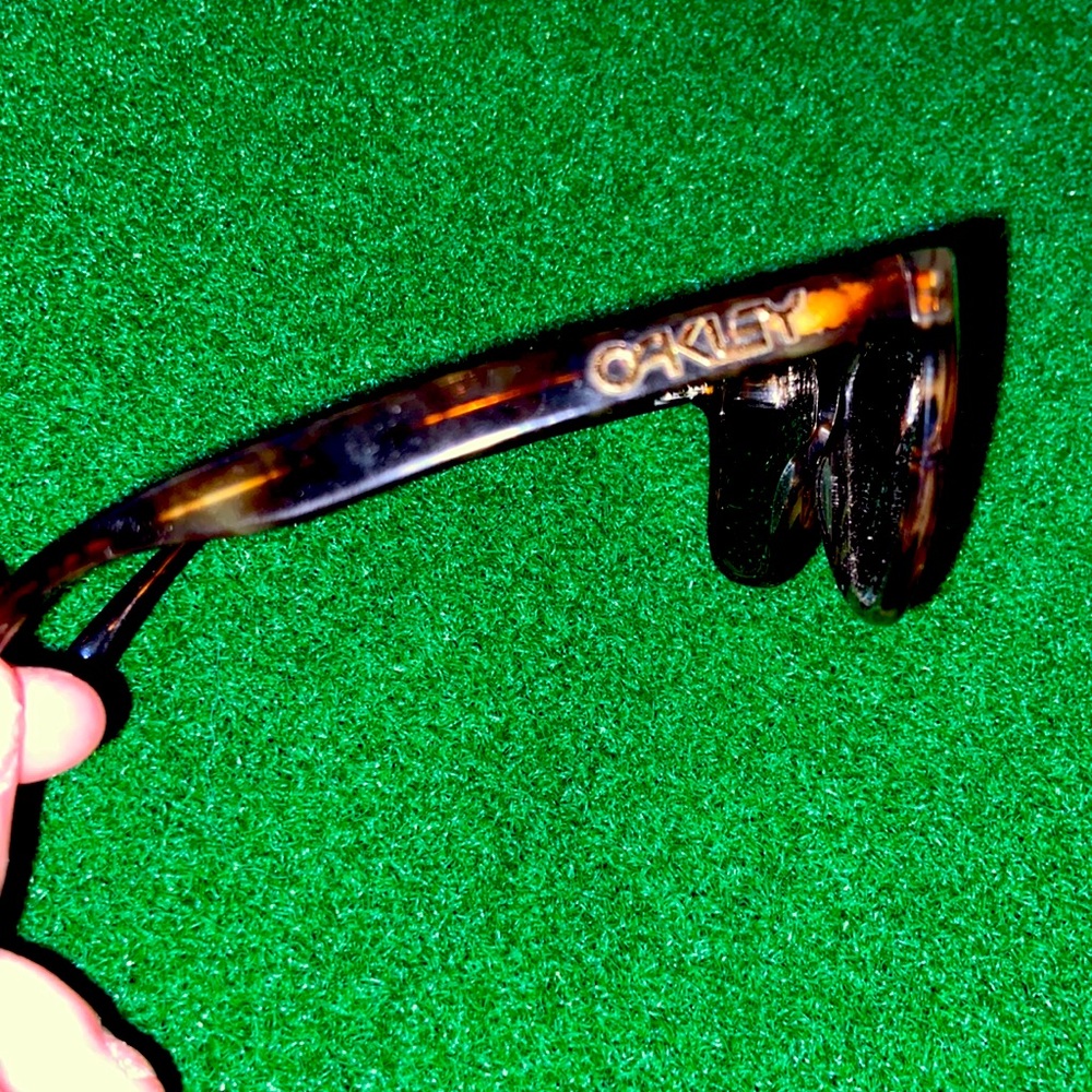 Oakley unisex sunglasses turquoise frames with brown polarized lenses